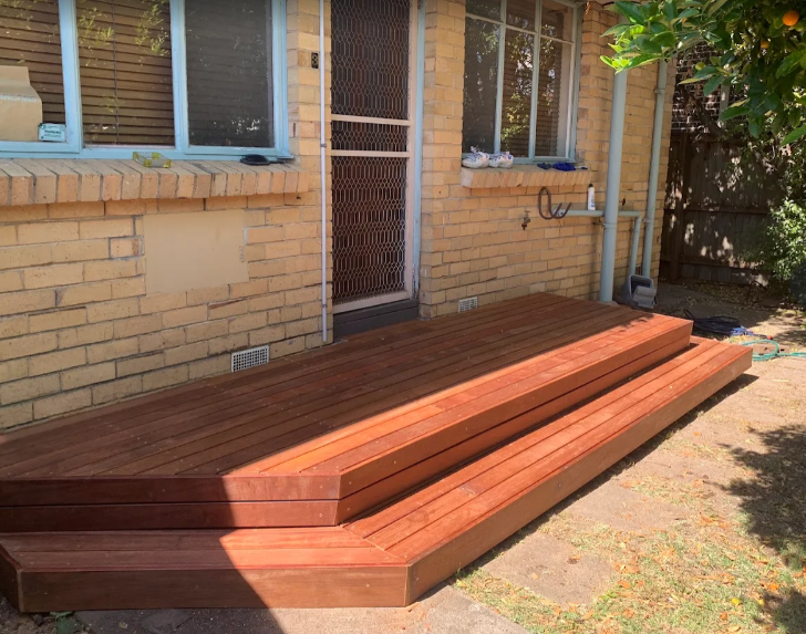 Timber deck with brick house